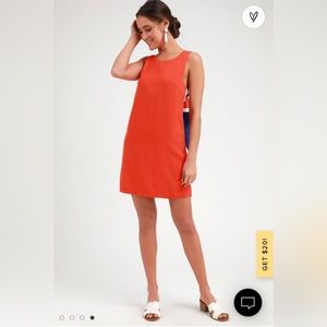 Fun mini orange dress with semi open back design